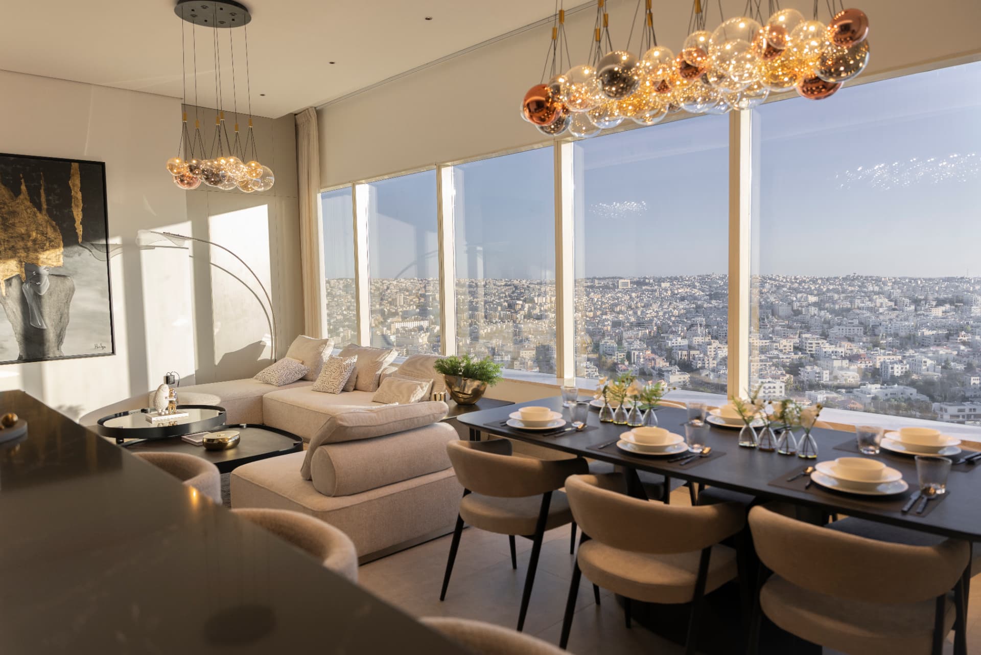 Apartment living and dining space with panoramic Amman views